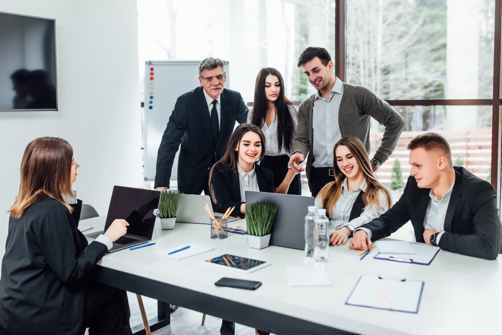 staff-meeting-group-young-modern-people-smart-casual-wear-discussing-something-while-working-creative-office-business-time (4)